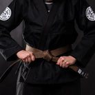 Bare Bones Gi with minimalist design, IBJJF-approved black BJJ gi for competition with Rubber Bones belt.
