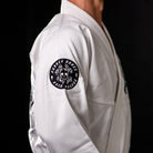 On-body side view of Inktober '21 Gi jacket highlighting logo embroidery and premium details.