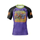 Front view of the Rubber Bones Trick or Treat BJJ rash guard with vibrant Halloween-themed artwork.