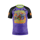 Front view of Rubber Bones Trick or Treat Kids BJJ rash guard featuring bold monster artwork, flames, and purple and black Halloween design.