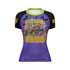 Digital render of Rubber Bones Trick or Treat women’s rash guard with neon green collar, Halloween artwork, and purple base.