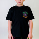 Kids Buggy Choke T-Shirt, front view, featuring a black shirt with green, orange, and purple Buggy Choke Pest Control graphic on the left chest.