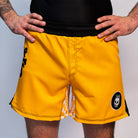 Volt Ranger BJJ Shorts (Full Fit on Model, Front View) – A male model wearing the yellow BJJ shorts, showing the waistband, leg cut, and overall fit with a relaxed stance.