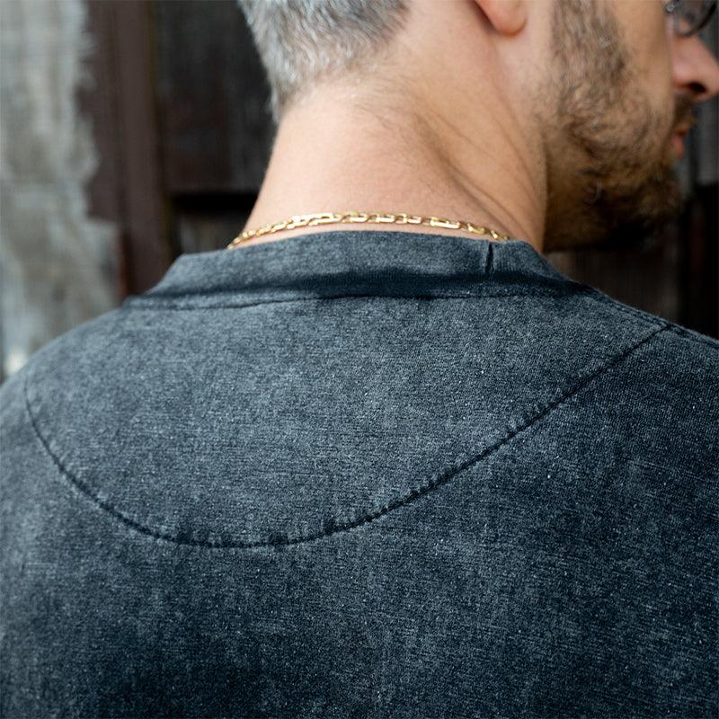 Close-up of the back of the Black Long Sleeve Acid Wash T-Shirt, showcasing acid-wash texture.