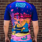 On-body back view of Invasion Short Sleeve Rash Guard highlighting alien and UFO-inspired designs.