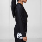 Side view of the Women’s Long Sleeve Ash BJJ Rash Guard showing flexible, form-fitting design with subtle marble detail.