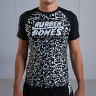On-body front view of Ranked Rash Guard - Black with skull web design and IBJJF-approved style.