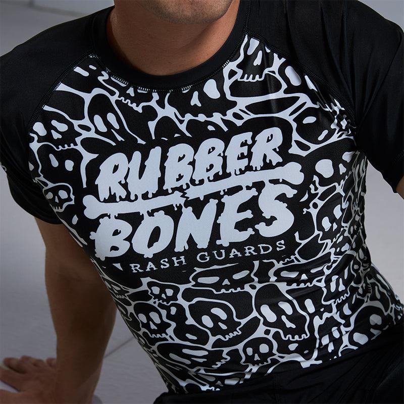 On-body close-up front detail view of Ranked Rash Guard - Black featuring skull web pattern and IBJJF-approved style.