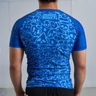 On-body back view of Ranked Rash Guard - Blue highlighting monochromatic artwork and durability.
