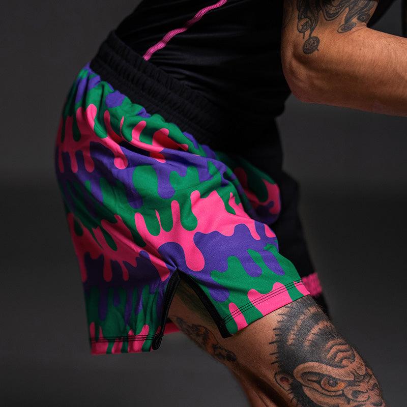 Close up of the Bubble Gum Grappling Shorts dripping bold pink, purple, green, and black design for Brazilian Jiu Jitsu.