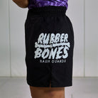 On-body side view of Competition Grappling Shorts, black and white IBJJF-approved shorts.