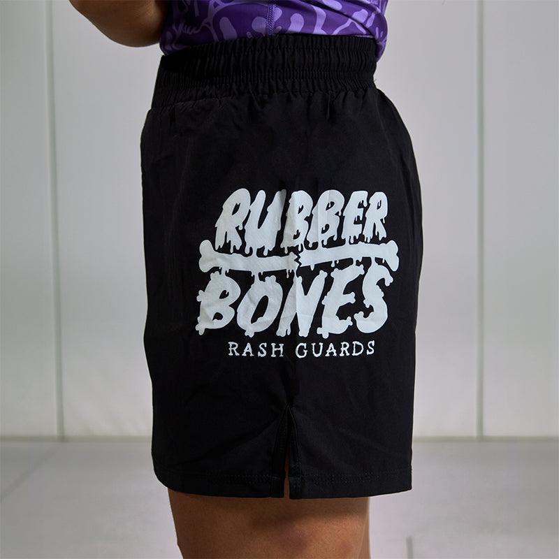 On-body side view of Competition Grappling Shorts, black and white IBJJF-approved shorts.