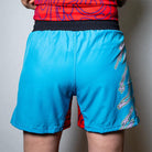 On-body back view of the blue Hannya Drip Grappling Shorts featuring bold Hannya-inspired artwork.