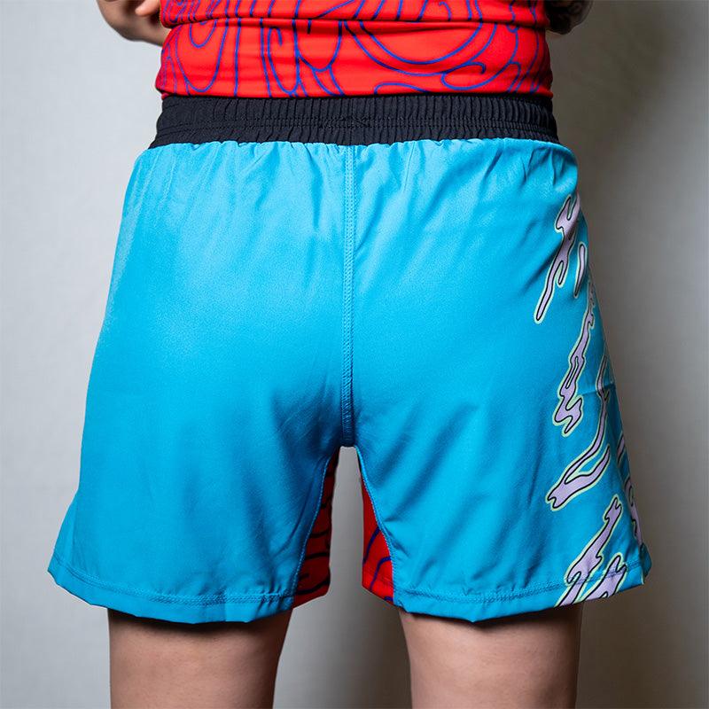On-body back view of the blue Hannya Drip Grappling Shorts featuring bold Hannya-inspired artwork.