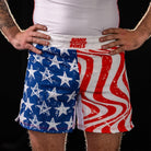 On-body front view of Independence Grappling Shorts featuring American flag-inspired design.