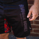 On-body close-up of Rubber Bones logo on OG 2.0 Velcro Grappling Shorts.