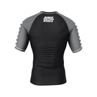 Shadow Ranger BJJ Rash Guard (Back View) – Short-sleeve BJJ rash guard with a black body, grey raglan sleeves, and a white "Rubber Bones" logo on the upper back.