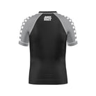 Shadow Ranger Kids BJJ Rash Guard (Back View) – Short-sleeve kids’ BJJ rash guard with a black torso, gray raglan sleeves with a white checkerboard pattern, and a white "Rubber Bones" logo on the upper back.