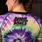 On-body right sleeve view of Women's Legalize Leg Locks Short Sleeve Rash Guard with Rubber Bones logo.