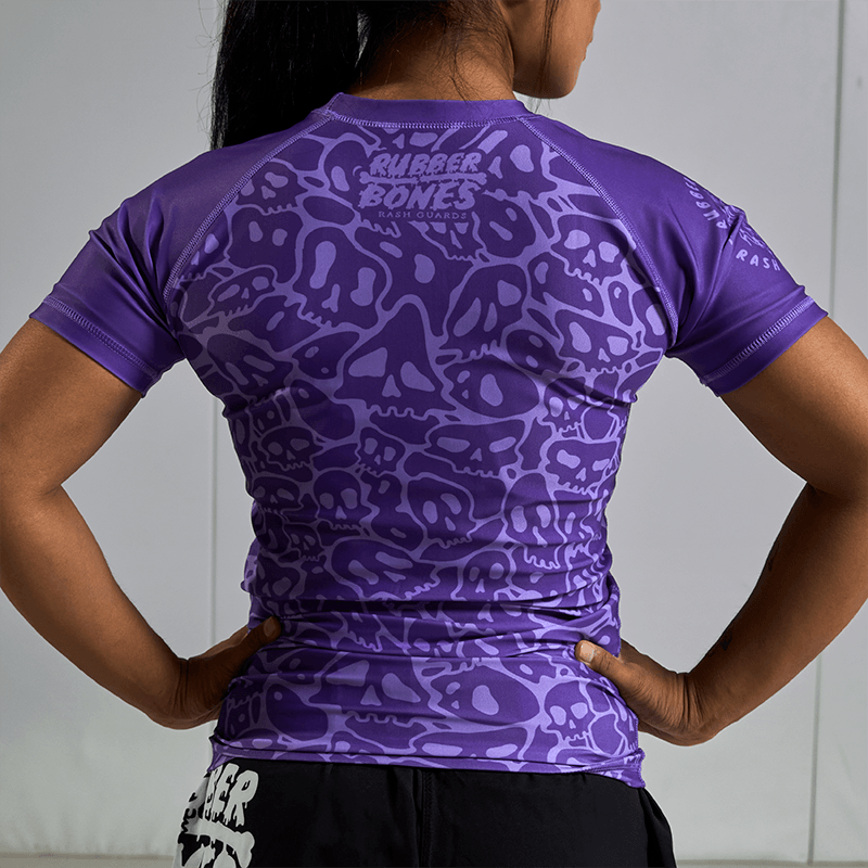 On-body back view of Women's Purple Ranked Rash Guard, showing the design and fit.
