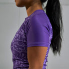 On-body side sleeve view of Women's Purple Ranked Rash Guard with blank sleeve design.