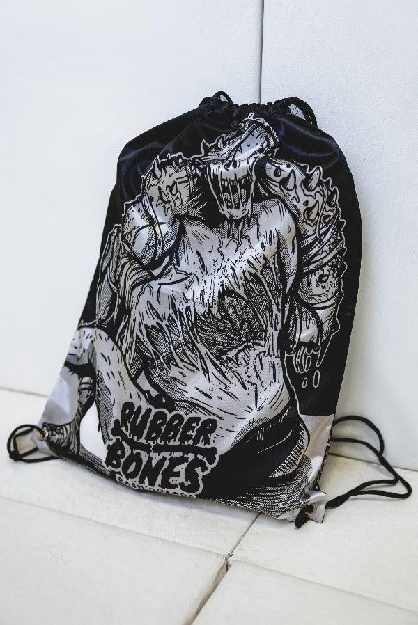 Product shot of Inktober '21 Gi satin drawstring bag featuring exclusive Inktober graphic.