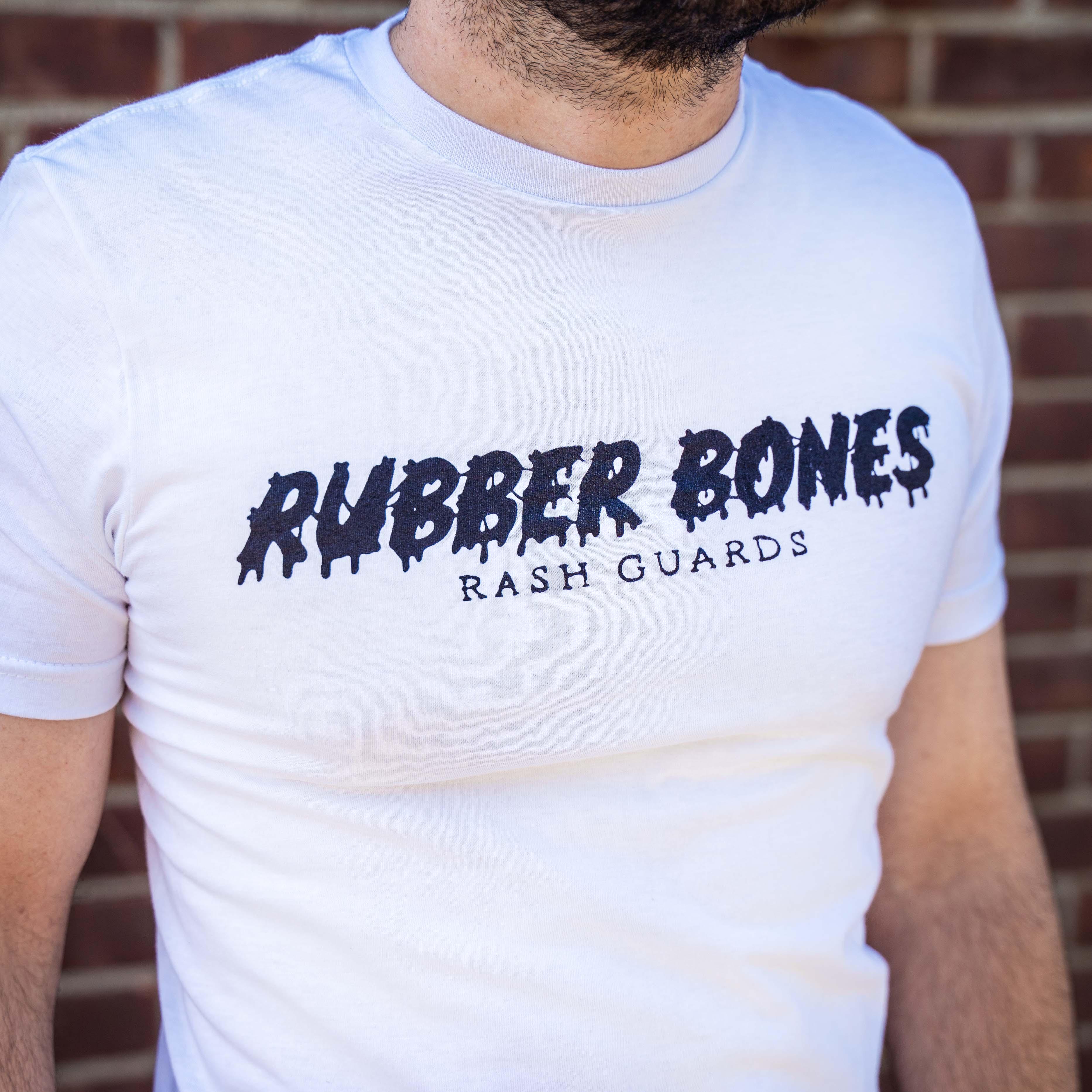 On-body front view of White Skull Back T-Shirt featuring Rubber Bones logo design.