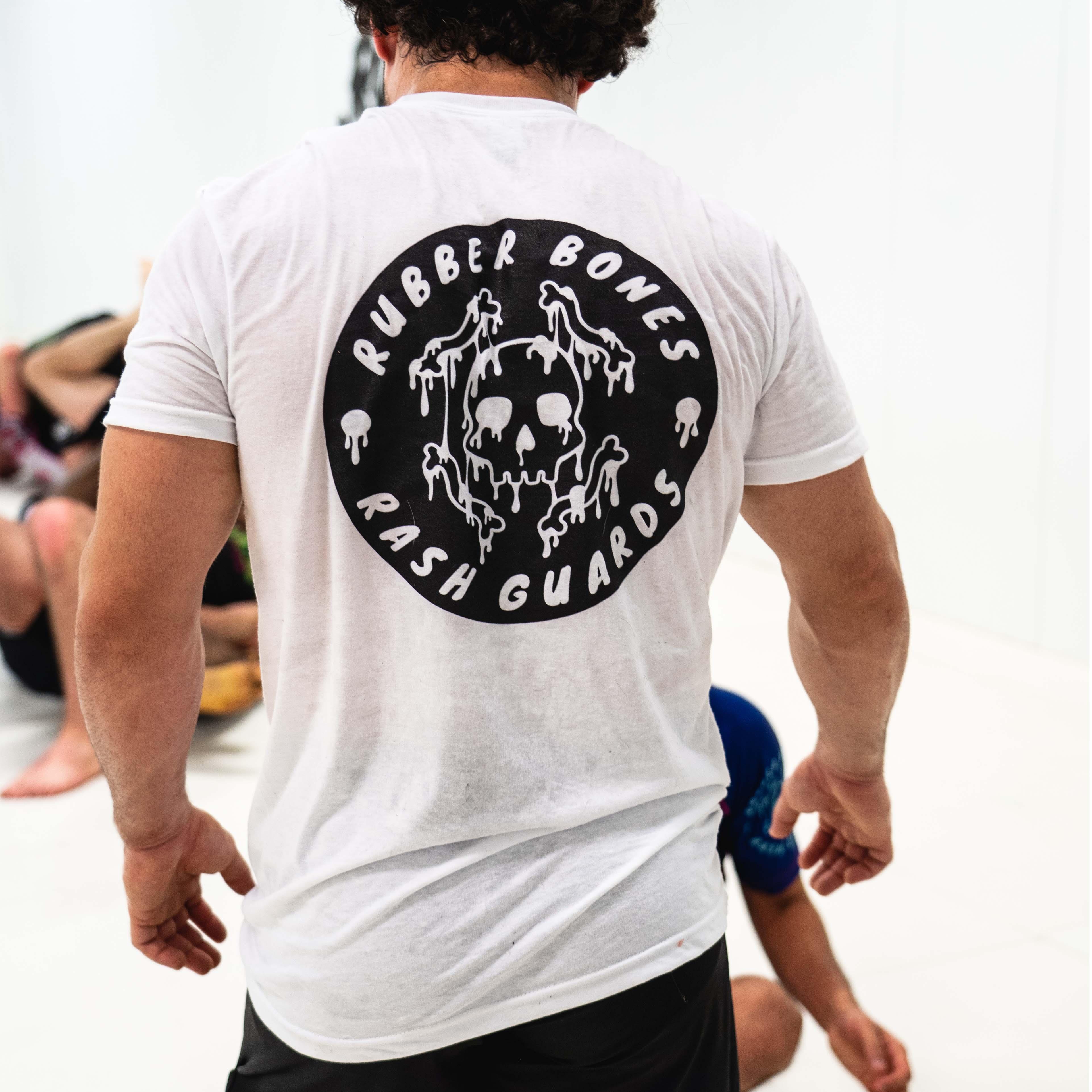 On-body back view of White Skull Back T-Shirt featuring striking skull design