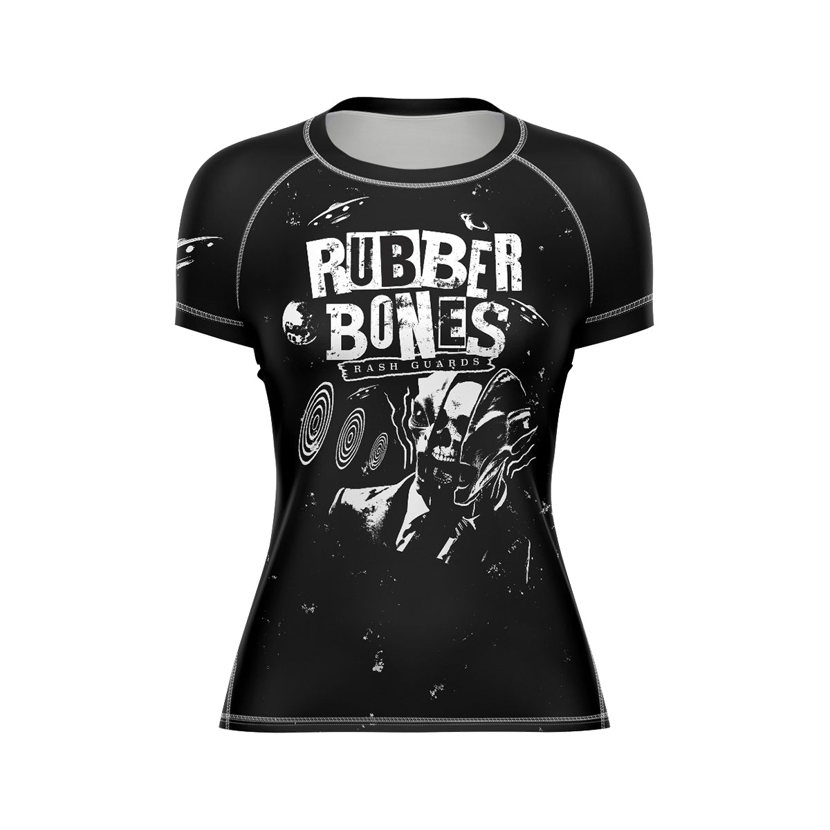 Black women's short-sleeve BJJ rash guard featuring a bold white 'Rubber Bones Rash Guards' logo across the chest. A surreal, skull-faced figure in a suit with hypnotic spirals and cosmic elements creates an artistic, edgy aesthetic.