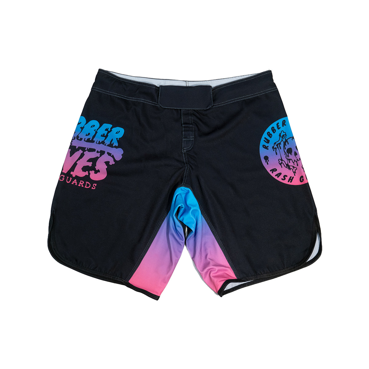 Black BJJ fight shorts featuring a vibrant blue-to-pink gradient design on the leg openings and inner gusset. The left leg displays the 'Rubber Bones Rash Guards' logo in a bold, retro-style font, while the right leg features a circular skull emblem with the same gradient effect. The shorts include a secure velcro waistband and reinforced stitching, designed for durability and movement on the mats.