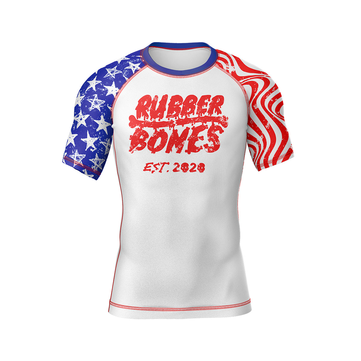 A short-sleeve BJJ rash guard with a white base and a distressed red, white, and blue design. The front features "Rubber Bones" in red with a grungy, weathered texture, along with "EST. 2020" beneath it. The sleeves are decorated with USA flag elements—red and white waves on one side and a blue field with white stars on the other.