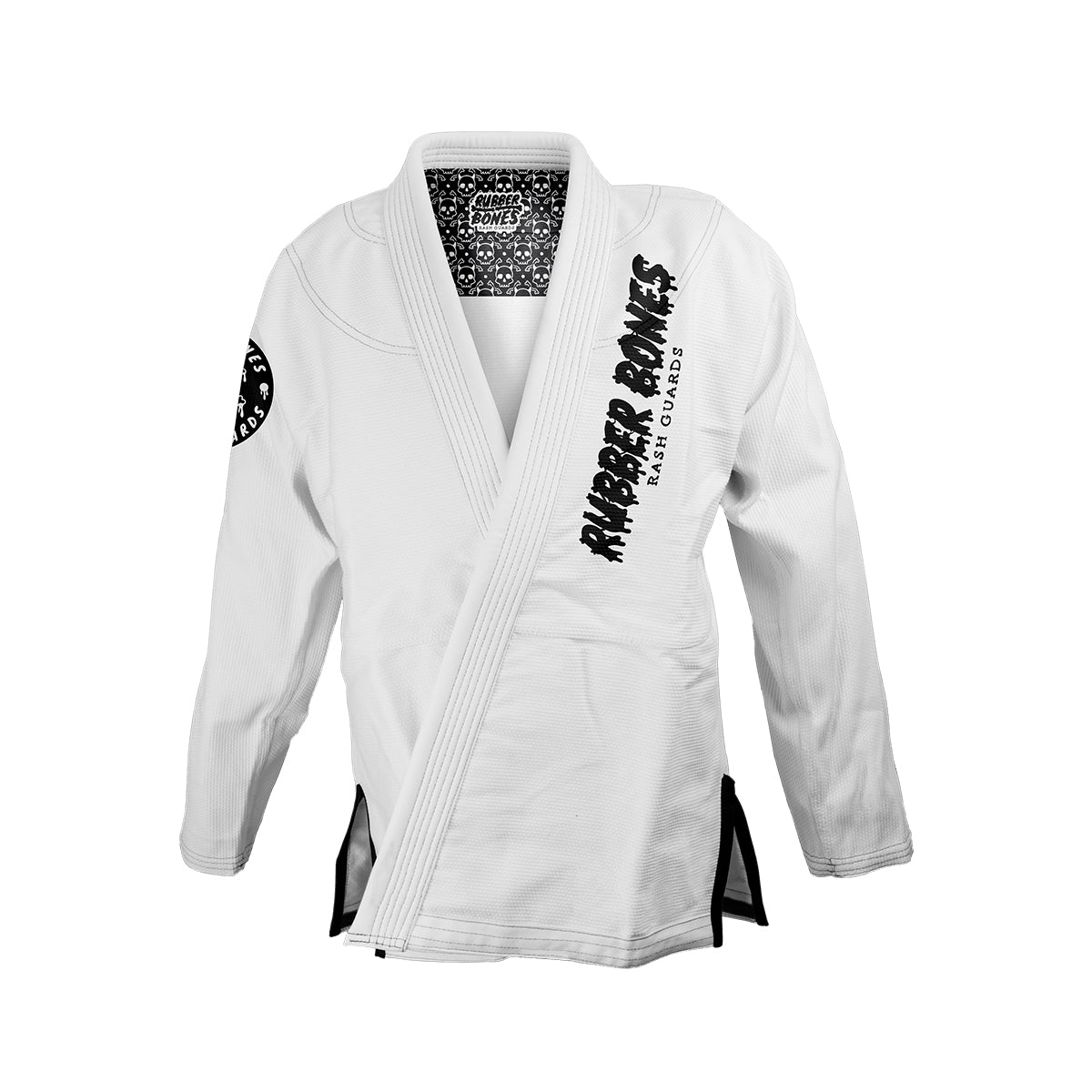 White Brazilian Jiu-Jitsu gi jacket featuring 'Rubber Bones Rash Guards' in bold, black, hand-drawn style lettering on the right chest. A black and white patterned lining is visible inside the collar, and a circular Rubber Bones patch is sewn onto the left sleeve. The gi has reinforced stitching and black side vents for durability and style.