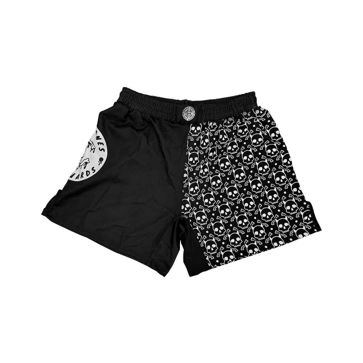 Black and white Rubber Bones BJJ shorts featuring a bold split design—one side solid black with a Rubber Bones logo patch, the other side covered in a repeating skull pattern. A modern take on classic BJJ shorts with an artistic edge.