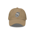 Front View: A khaki dad hat with the Rubber Bones icon embroidered in white and black on the front.