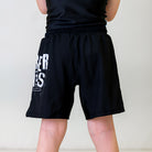  Kids BJJ Cosmic Truth Shorts, back view, showcasing clean black fabric with white Cosmic Truth-themed detailing.