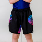 Cotton Candy Kids BJJ Shorts, front view, featuring black shorts with pink and blue gradient logos.