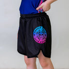 Cotton Candy Kids BJJ Shorts, left side view, featuring a circular Rubber Bones logo with a skull in a pink and blue gradient on black fabric.