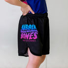 Cotton Candy Kids BJJ Shorts, right side view, showcasing the regular Rubber Bones logo in a pink and blue gradient on black fabric.