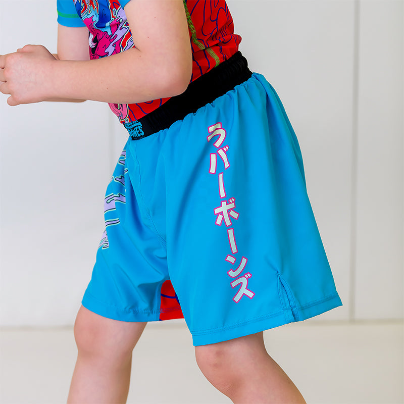 Light blue Hannya Youth Shorts, left side view, highlighting Japanese lettering spelling "Rubber Bones."