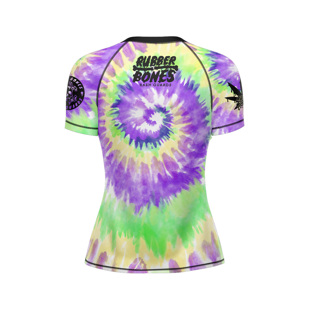 Women's short-sleeve BJJ rash guard in tie-dye purple, green, and yellow with a spiral pattern. Features the 'Rubber Bones Rash Guards' logo in black on the upper back.