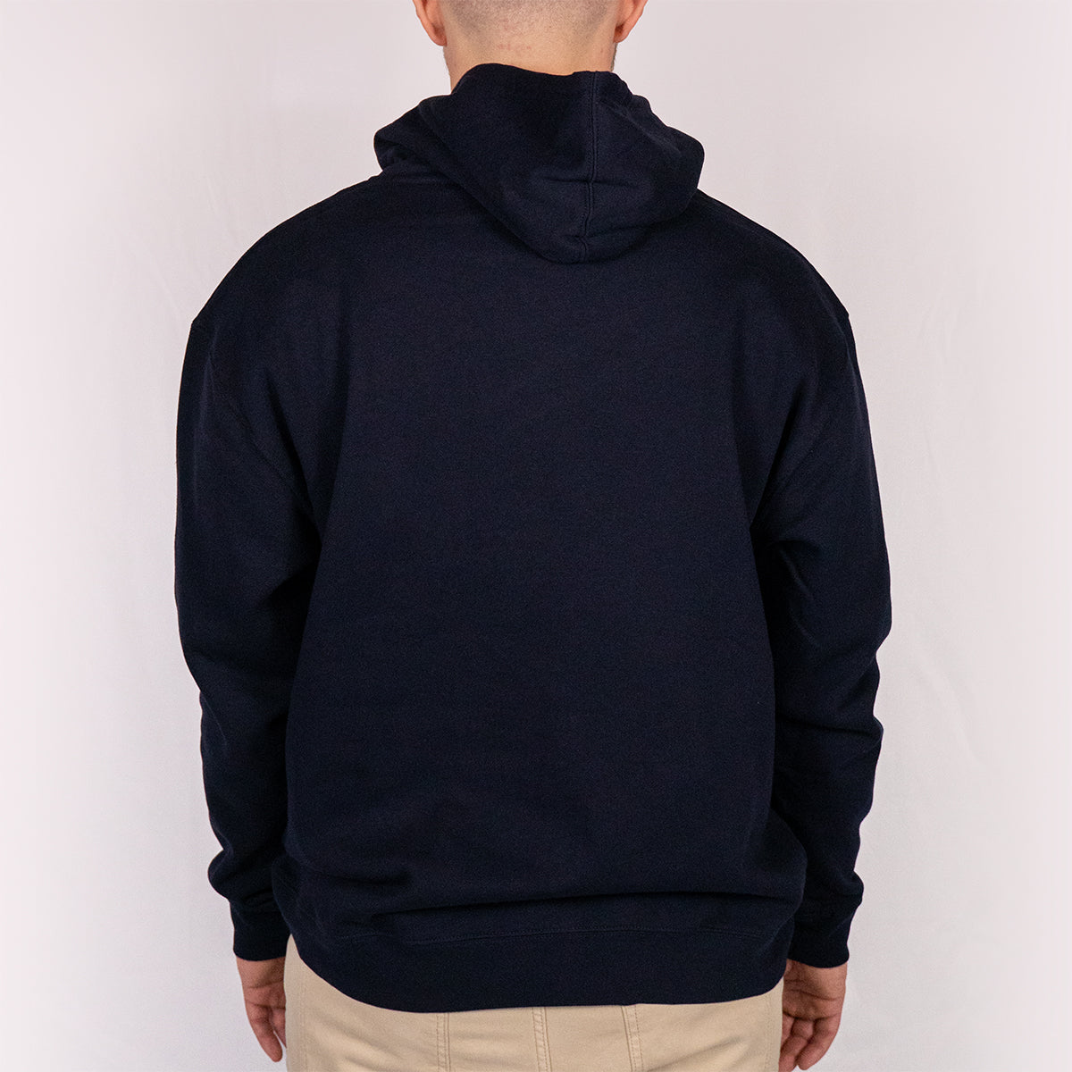 Back view of navy Yeti Games hoodie showing clean back panel, double-drawstring hood, and heavyweight Independent Trading Co fleece construction.