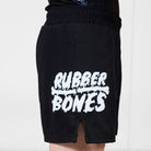 Men’s Ash BJJ Shorts side view with large white Rubber Bones logo printed near hem.