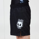 Men’s Ash BJJ Shorts side view featuring Rubber Bones skull logo and small front slit detail.