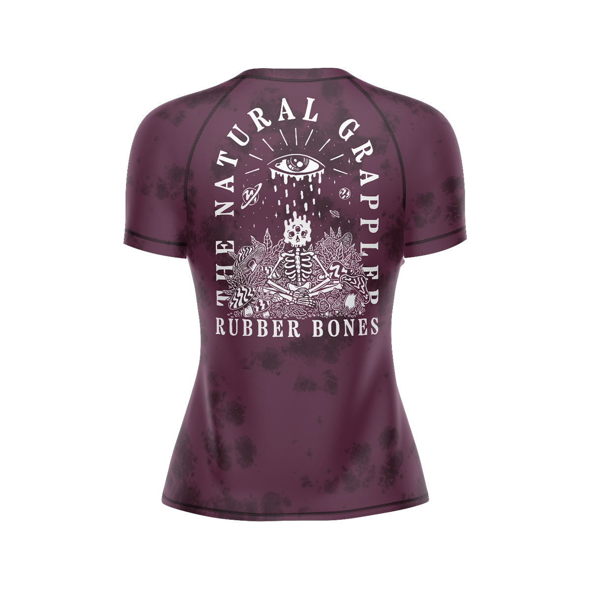 Rubber Bones 'Natural Grappler' Women's BJJ Rash Guard – Back View. Maroon short-sleeve rash guard with a black tie-dye effect. Features an intricate white illustration of a skeleton surrounded by cosmic elements, with 'The Natural Grappler' and 'Rubber Bones' text arching over the design.