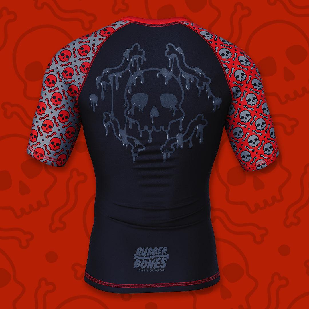 Mock-up of OG 2.0 Rash Guard showcasing bold design with black, red, and grey accents, back view.