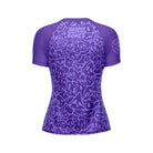 Mock-up of Women's Purple Ranked Rash Guard showcasing the back design with bold skull web pattern and IBJJF approval.