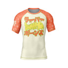 Short-sleeve BJJ rash guard in cream with orange sleeves featuring sushi-themed graphics. The chest showcases a neon green fish skeleton with Japanese characters dripping in stylized lettering.