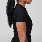 Alternate side view of the Women’s Ash BJJ Rash Guard highlighting slim athletic fit and subtle marble detailing.