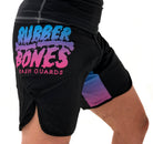 On-body side view of Cotton Candy Grappling Shorts showing vibrant pastel design and velcro closure.